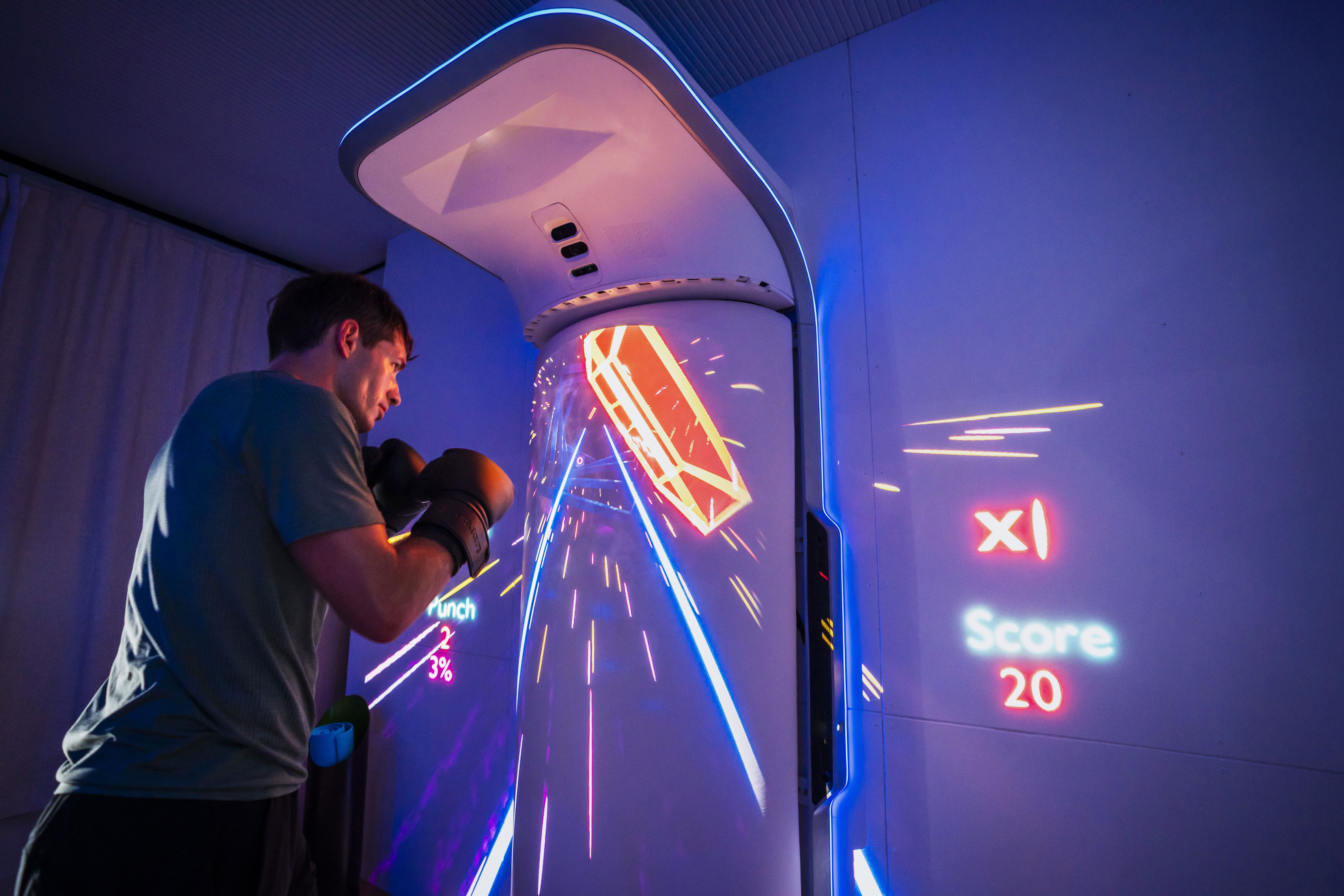 Man punching AI-Powered Gamified Boxing Game on GROWL